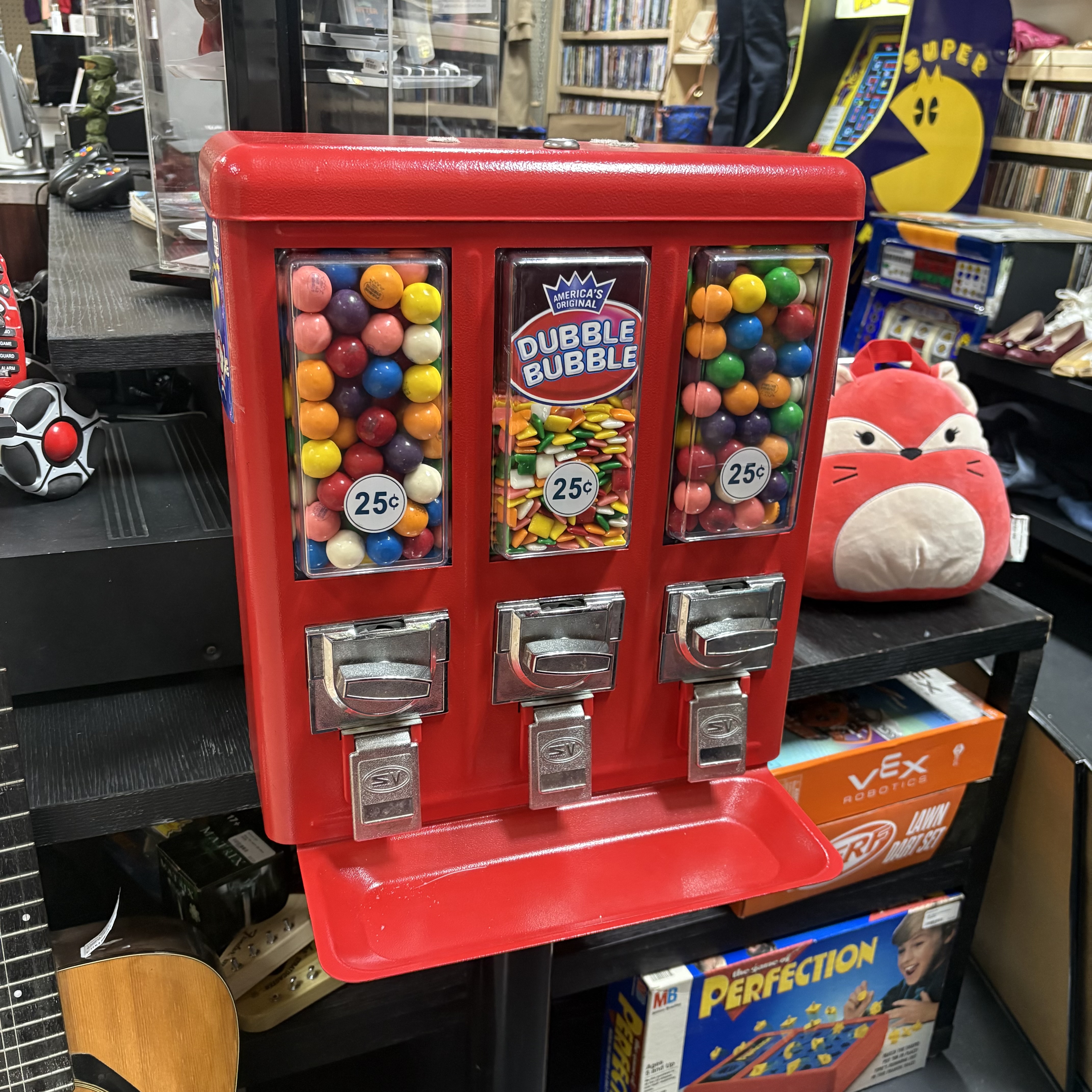 Red vintage gumball machine in the shop